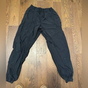 Black Nike windbreaker pants
